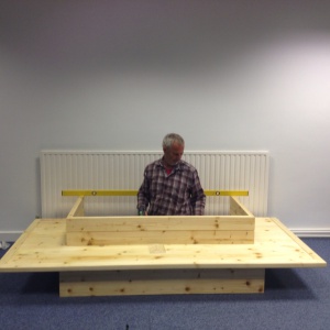 Gunapala building the shrine in the centre